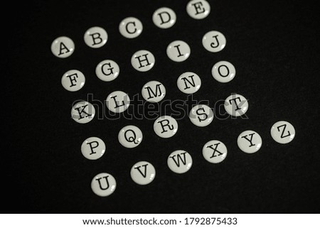 Full english alphabet on black on background. 