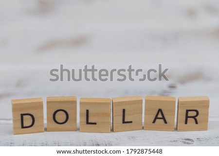 Dollar wooden letters on wood vintage background