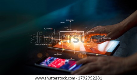  Digital marketing network connection concept. Businessman hand working on digital tablet with graphical user interface icons on strategy, solution analysis and development contents. Royalty-Free Stock Photo #1792952281
