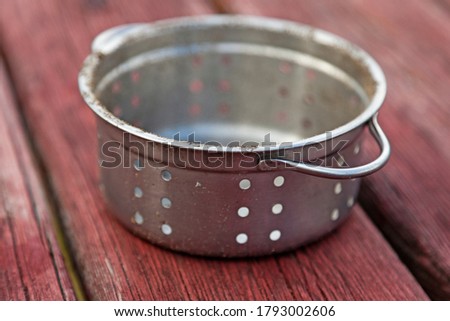 strainer used for cooking found at playground