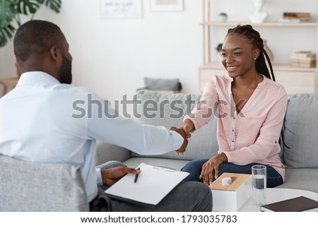 Nice To Meet You. Black male therapist meeting woman for counselling session, greeting each other with handshake, selective focus, free space Royalty-Free Stock Photo #1793035783