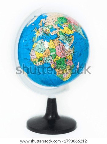 Plastic globe with Africa continent on foreground, a white background