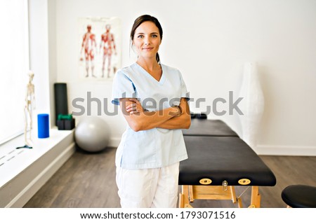 A Portrait of a physiotherapy woman smiling in uniforme Royalty-Free Stock Photo #1793071516