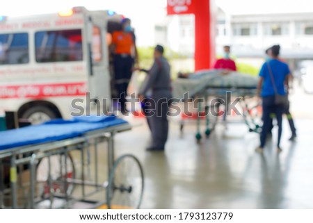 The motion blur of the patient that the stretcher or Gurney was pushed with speed through the hospital corridor to the emergency room.