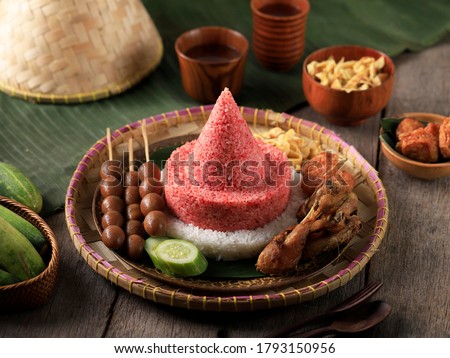 Cone Shape Red and White  Rice Called Nasi Tumpeng Same as Indonesian National Flag for Independence Day Celebration at 17 August Royalty-Free Stock Photo #1793150956