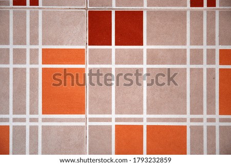 The pattern of the floor tile is colorful.