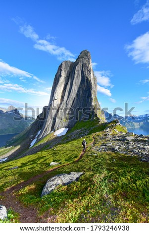 Segla the most iconic peak of Norwegian Senja island, the most beautiful cliffed mountain above the arctic fjord. Located in Northern of Norway. Royalty-Free Stock Photo #1793246938