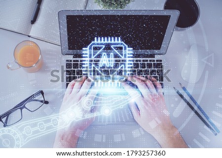 Multi exposure of man's hands typing over computer keyboard and data theme hologram drawing. Top view. Technology concept.