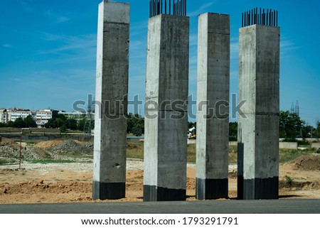 Concrete pillars for an aero duct at the roadside. Royalty-Free Stock Photo #1793291791