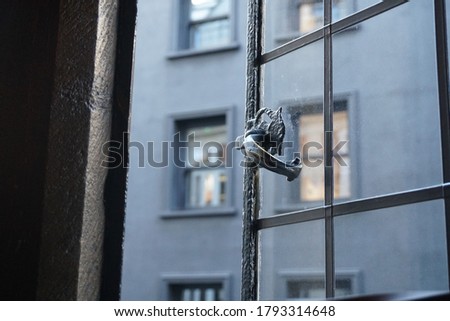 Window steel handle on the metal frame vintage house interior style