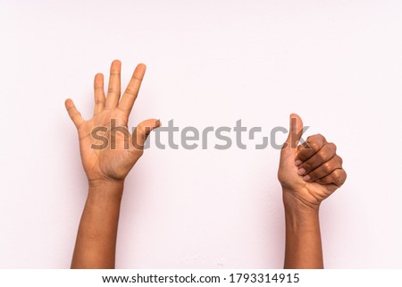 hand counting six over isolated colorful background