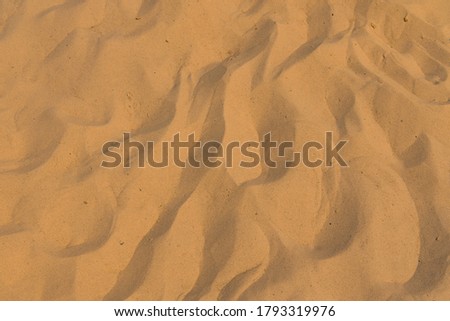 wavy sand background desert textured wallpaper pattern yellow surface