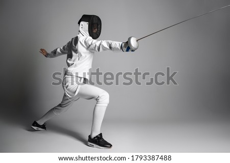 athlete swordsman on a white background Royalty-Free Stock Photo #1793387488