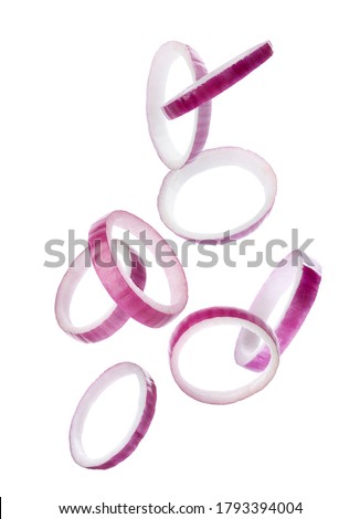 Red onion slices falling on white background Royalty-Free Stock Photo #1793394004