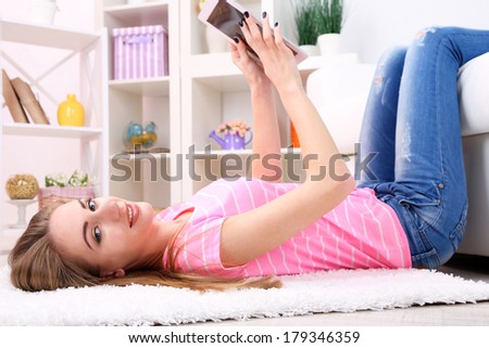 Young woman resting with  tablet at home
