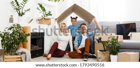 concept housing a young family. Mother father and child in new house with a roof at a home