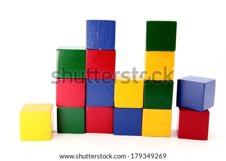 Colorful wooden childen's building blocks scattered loose 