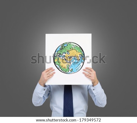 A man holding a picture with the world map (Africa, Asia) 6