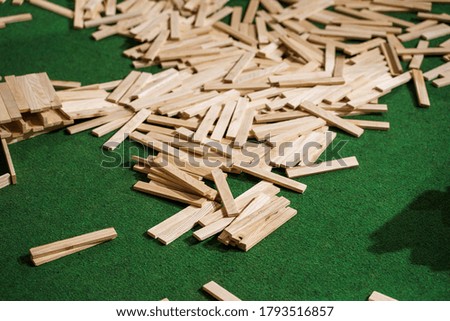 A heap of a wooden blocks tower pieces after tower collapse