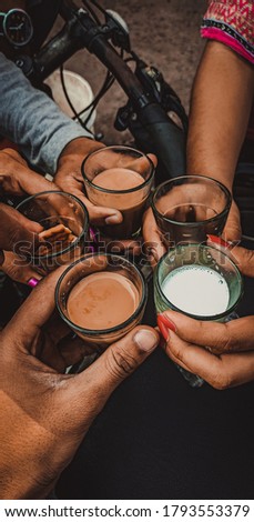 a picture of 5 friends hanging out and having tea and milk