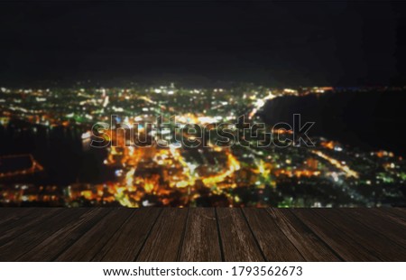 wooden top table with blurred city  background
