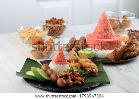 Red and White  Rice Called Nasi Tumpeng Same as Indonesian National Flag for Independence Day Celebration at 17 August Royalty-Free Stock Photo #1793567596