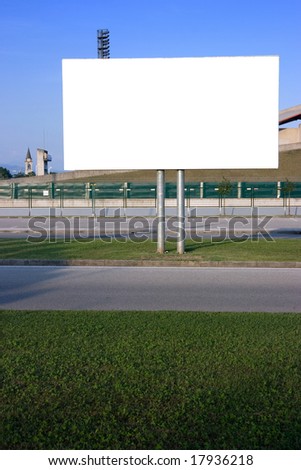 Blank billboard on the street at sunset