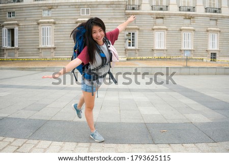 young Asian woman visiting Europe in holidays as backpacker tourist - lifestyle portrait of happy and attractive Korean girl enjoying city tour cheerful in tourism and vacation travel concept