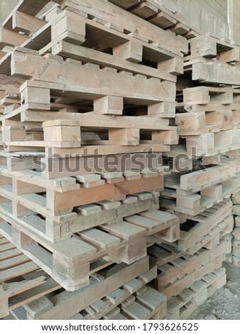 Stack of wooden pallets at a warehouse