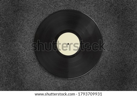 Old vinyl record on a black background