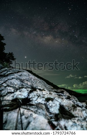 Long exposure Night Photography with Milky way over sea in phuket thailand