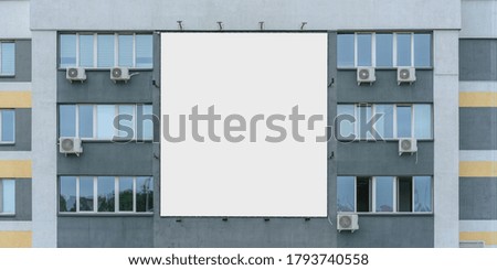 big empty white banner on wall of modern building office with air conditioners front view