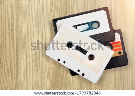 Retro old cassette on a wooden desk.