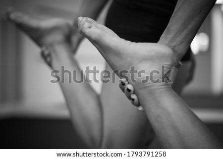 Series of monochromatic black and white photographs taken in a yoga studio. These images explore the yogic grips common in a yoga class.