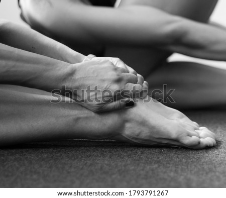Series of monochromatic black and white photographs taken in a yoga studio. These images explore the yogic grips common in a yoga class.