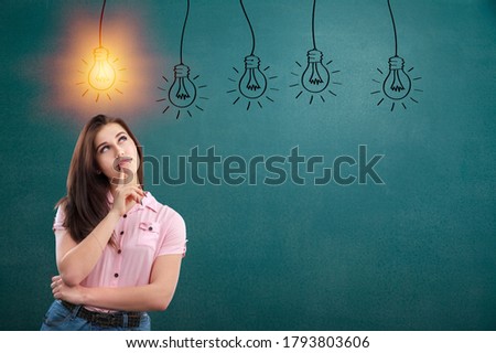 Business person looking for new idea with light bulbs on the background