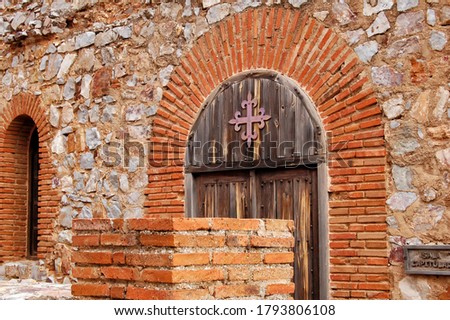 Door of a room in the castle of Calatrava la Nueva, with the cross of the Order of Calatrava, in Ciudad Real