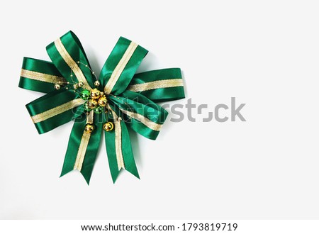 Green gift bow. Ribbon. Isolated on white