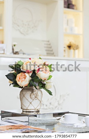 A cup of coffee "Americano" and a beautiful elegant bouquet of roses