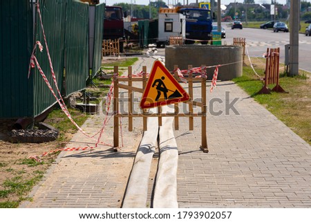 Road works sign during street reconstruction. Road signs.