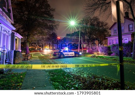 crime scene with tape and police car Royalty-Free Stock Photo #1793905801