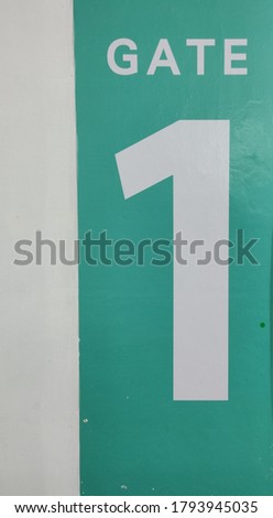 Gate 1 sign in green and white color