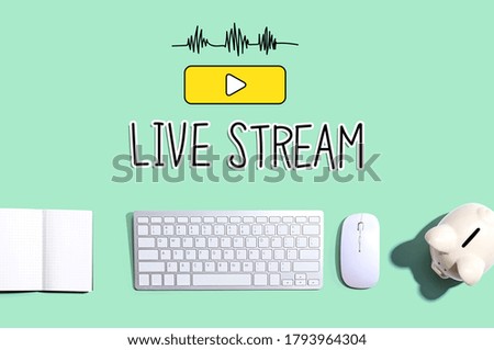 Live stream with a computer keyboard and a piggy bank