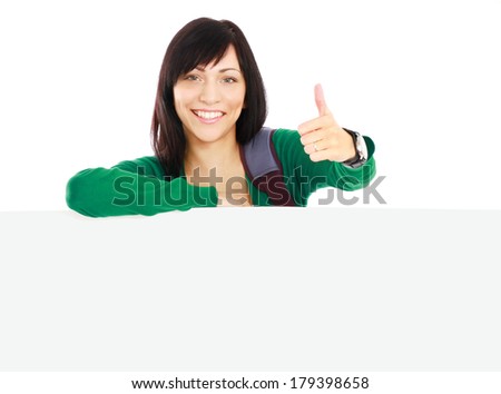 A smiling girl with a blank and thumb up sign, isolated on white background