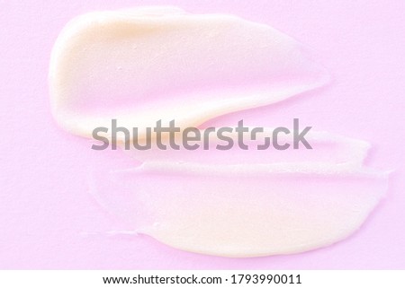Cosmetic cream close-up. Macro photo. The concept of cosmetic products, skin and hair care, beauty and health. Background image in trendy pink.
