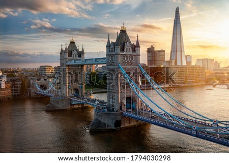 Elevated view of the famous Tower Bridge and skyline of London, UK, during beautiful sunset time in summer