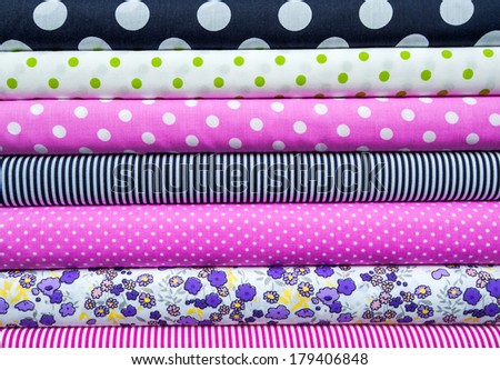 retro textiles and fabrics of different colors in the stack