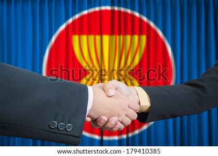 ASEAN Economic Community in businessman handshake Royalty-Free Stock Photo #179410385