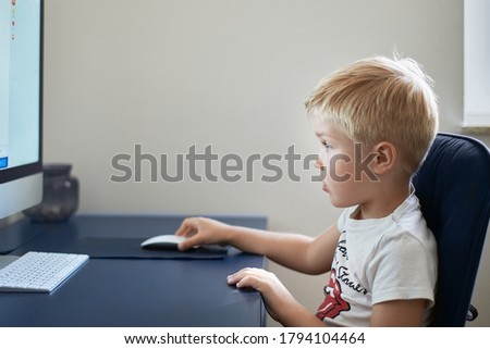 Child study at the computer home. Education, online study, home studying, technology, science, future, distance learning, homework, schoolgirl children lifestyle concept. High-quality photo