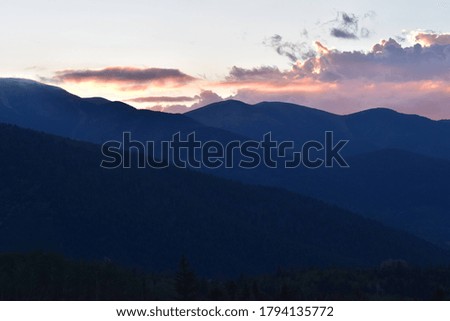 mountain top pink and blue sky